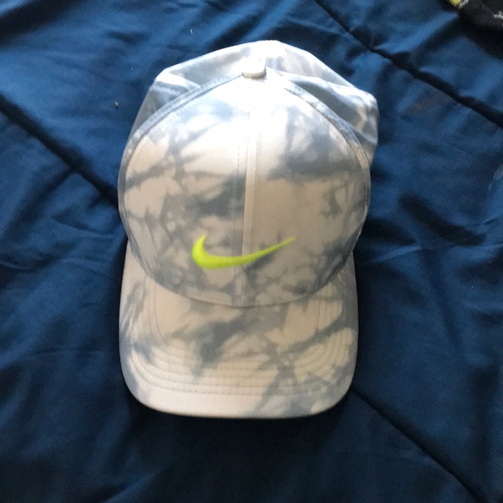 Blue and white Nike hat with lime green checks